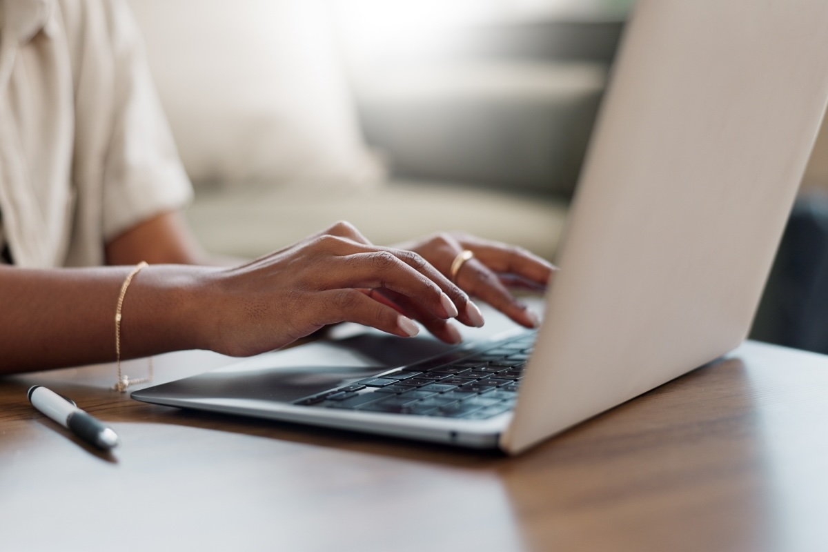 woman typing on a laptop