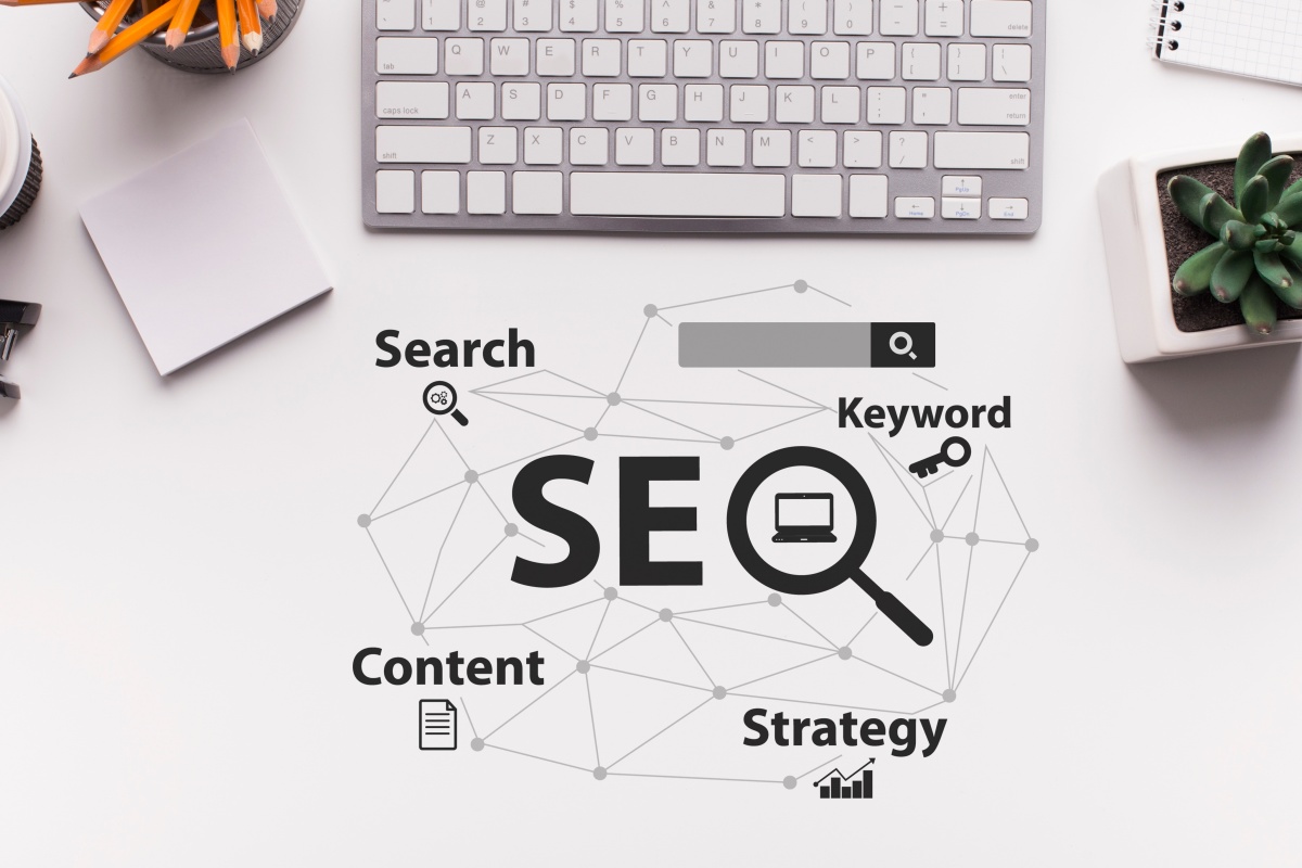 Seo Strategy. Seo-Optimization Scheme With Words Over White Office Desk Background With Computer Keyboard. 