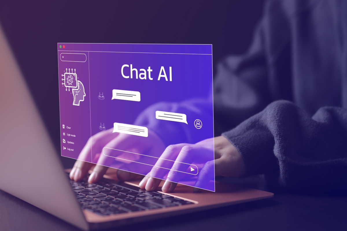 Person using a laptop chatting with an intelligent artificial intelligence.